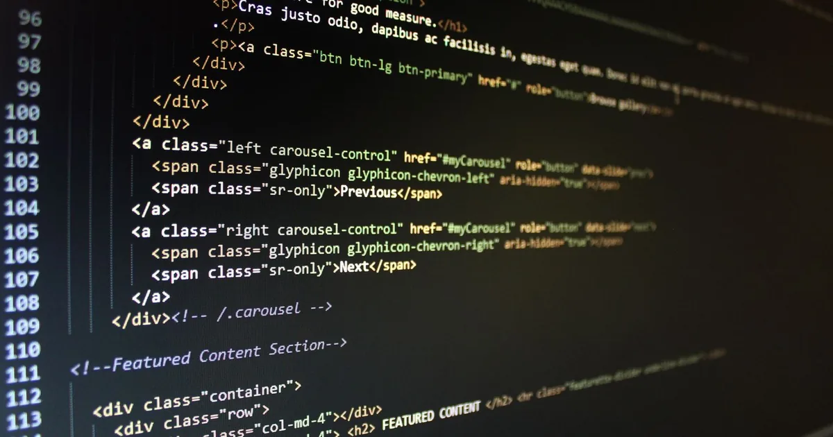 Code editor with JavaScript and HTML open on a dark-themed screen.